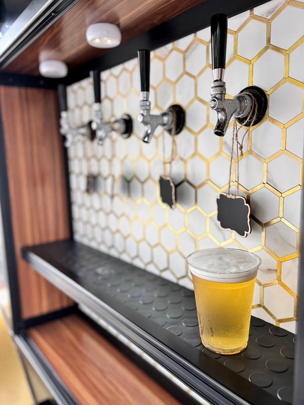 Close-up of the stainless faucets on the self-serve tap wall
